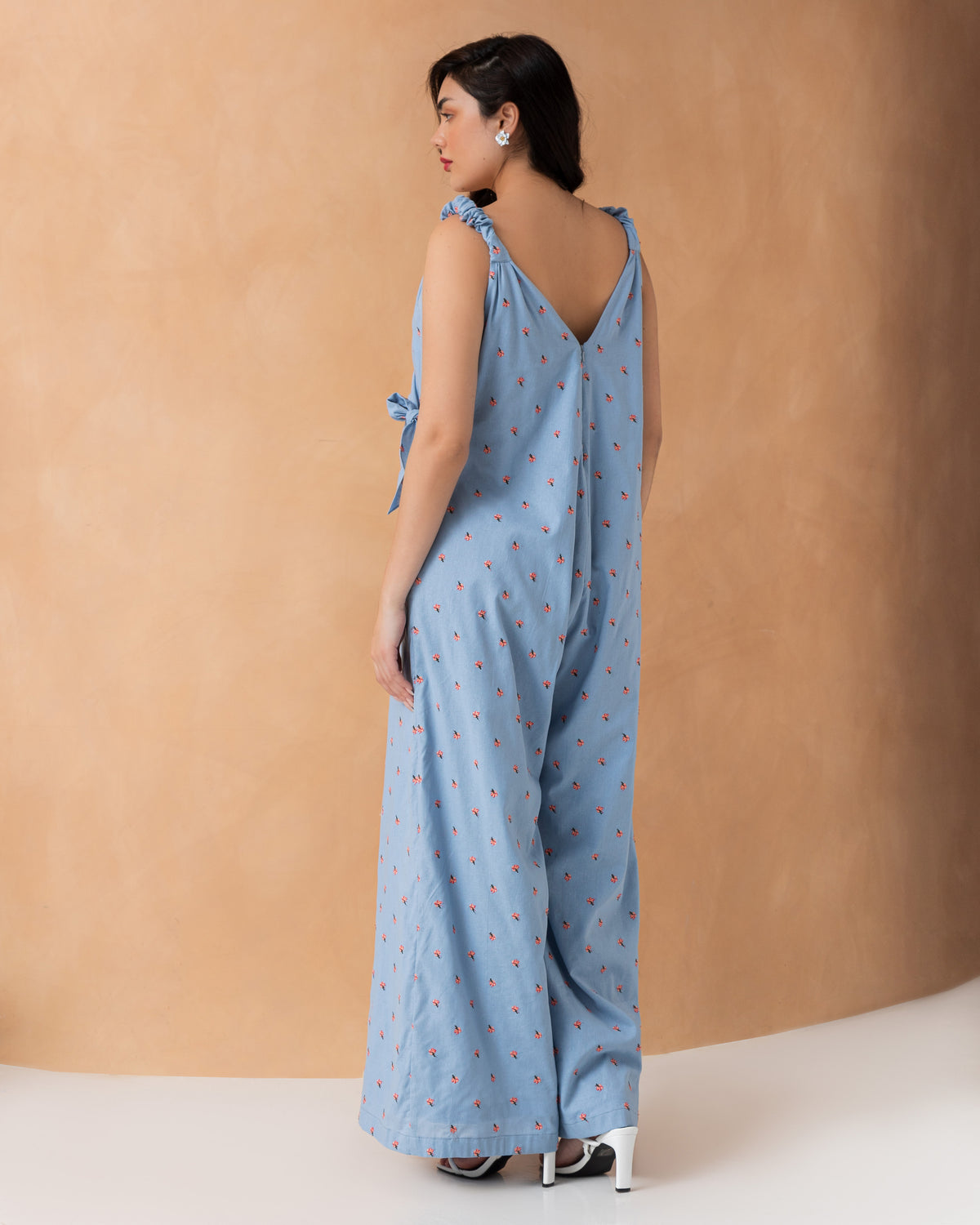 Sleeveless overlapped cotton jumpsuit with mini embroidered flowers