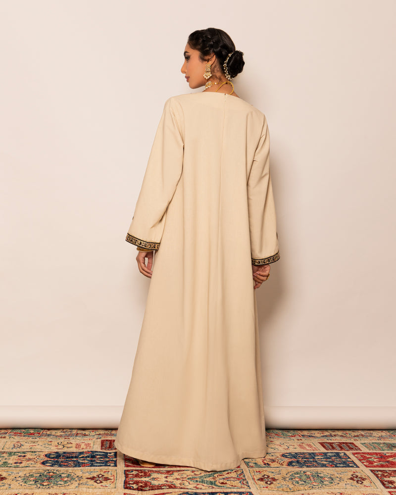 Linen kaftan with unsymmetrical embellished trimmed neckline