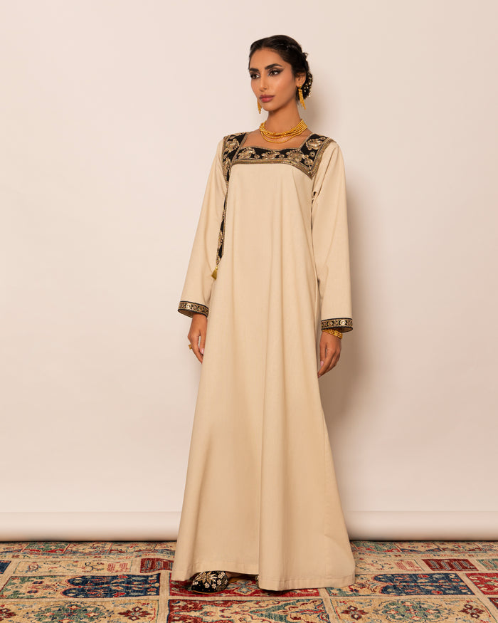 Linen kaftan embellished with traditional trimmed neckline