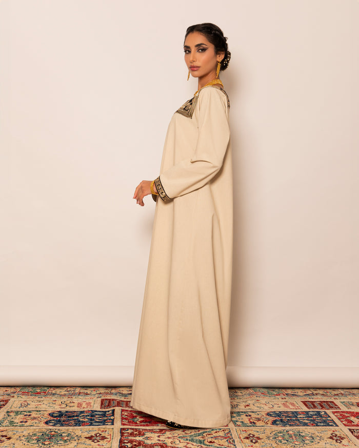 Linen kaftan embellished with traditional trimmed neckline