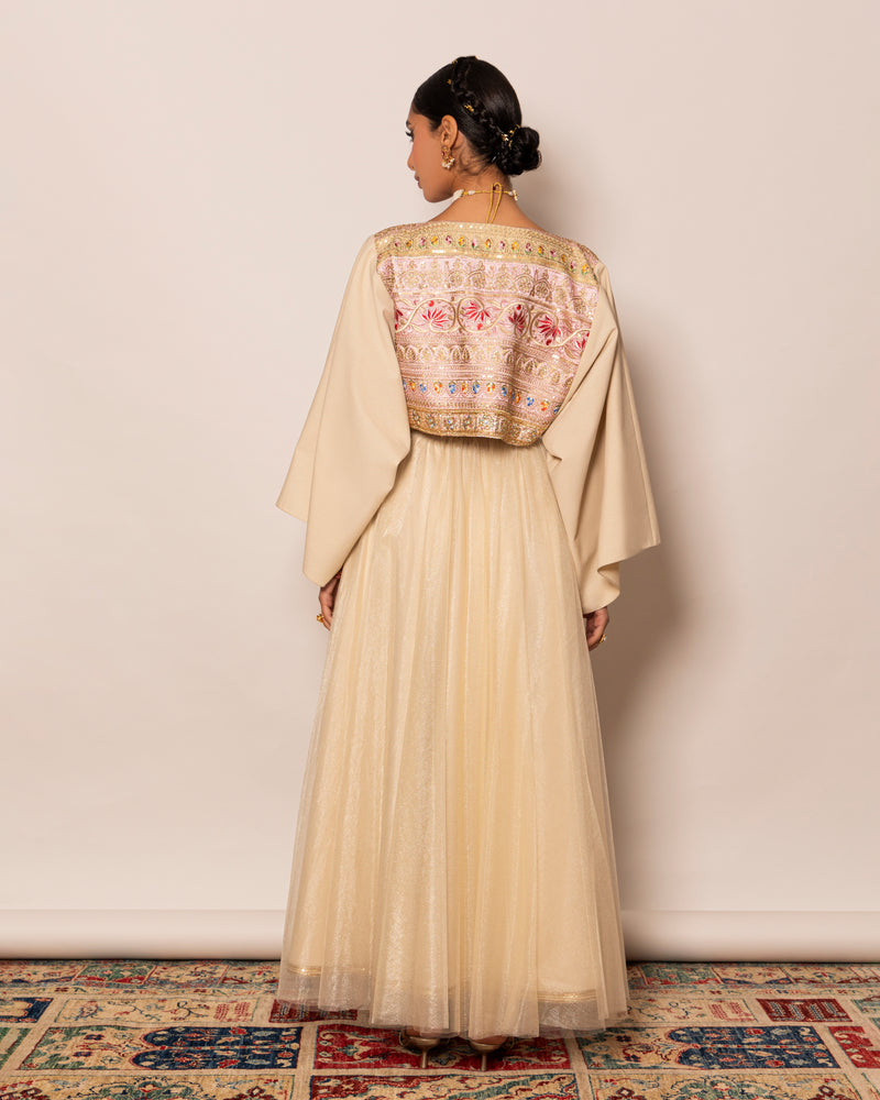 Poncho style top in linen with embellished centered trimming & shiny tulle skirt with trimmed hemline