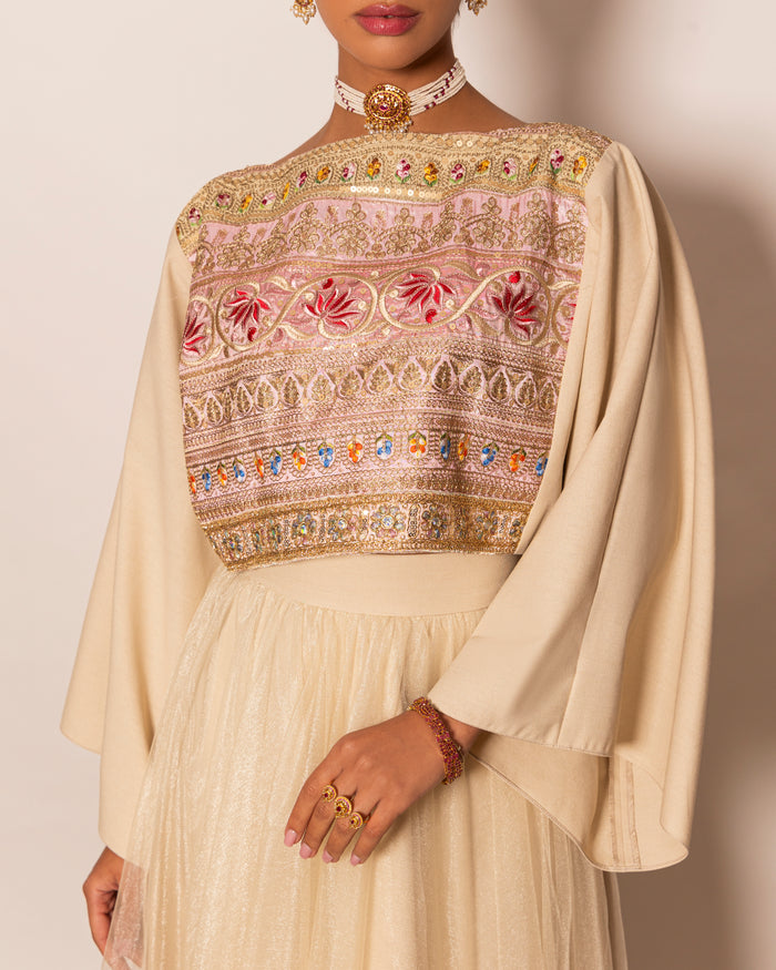 Poncho style top in linen with embellished centered trimming & shiny tulle skirt with trimmed hemline