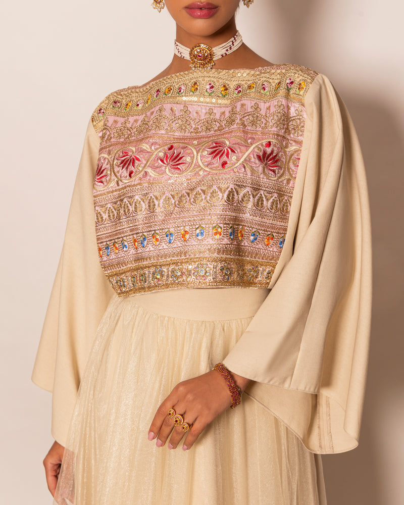 Poncho style top in linen with embellished centered trimming & shiny tulle skirt with trimmed hemline