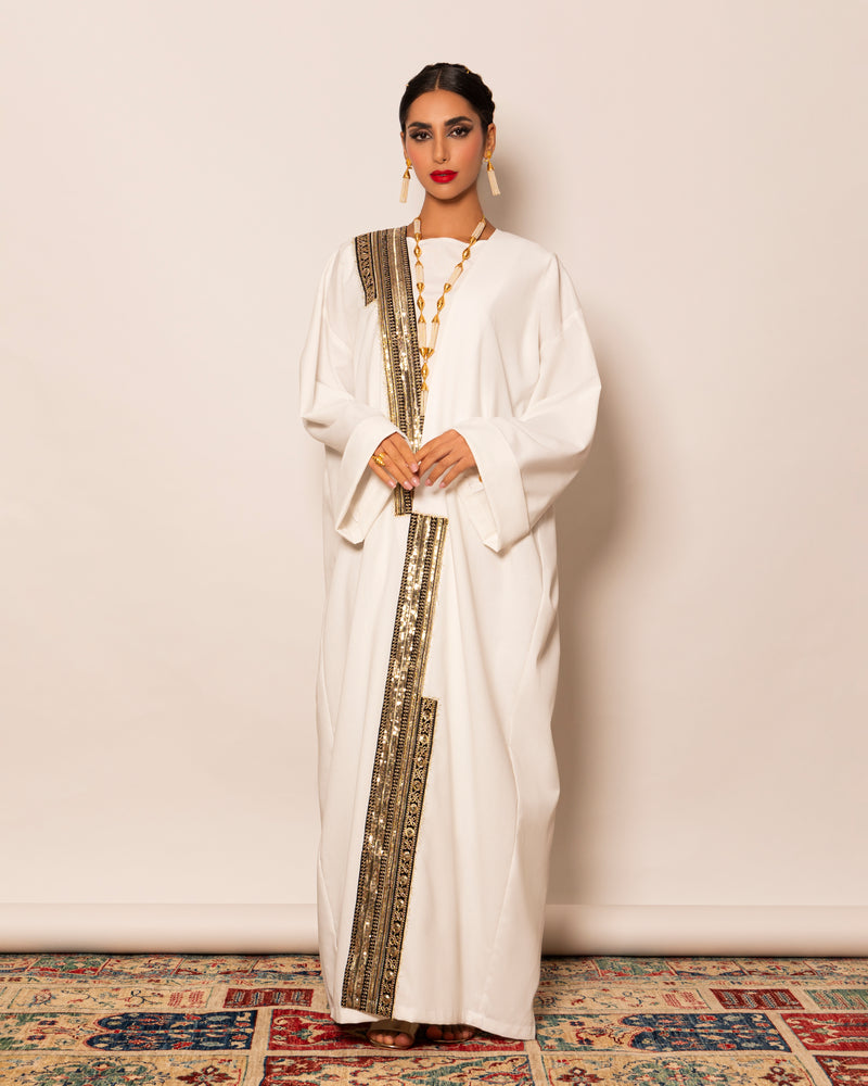 Classic linen abaya with unsymmetrical embellished trimmings