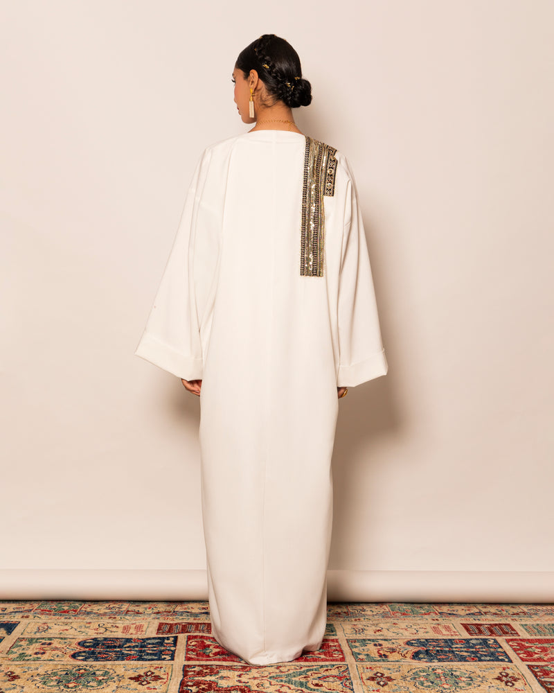 Classic linen abaya with unsymmetrical embellished trimmings