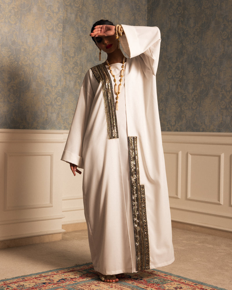 Classic linen abaya with unsymmetrical embellished trimmings