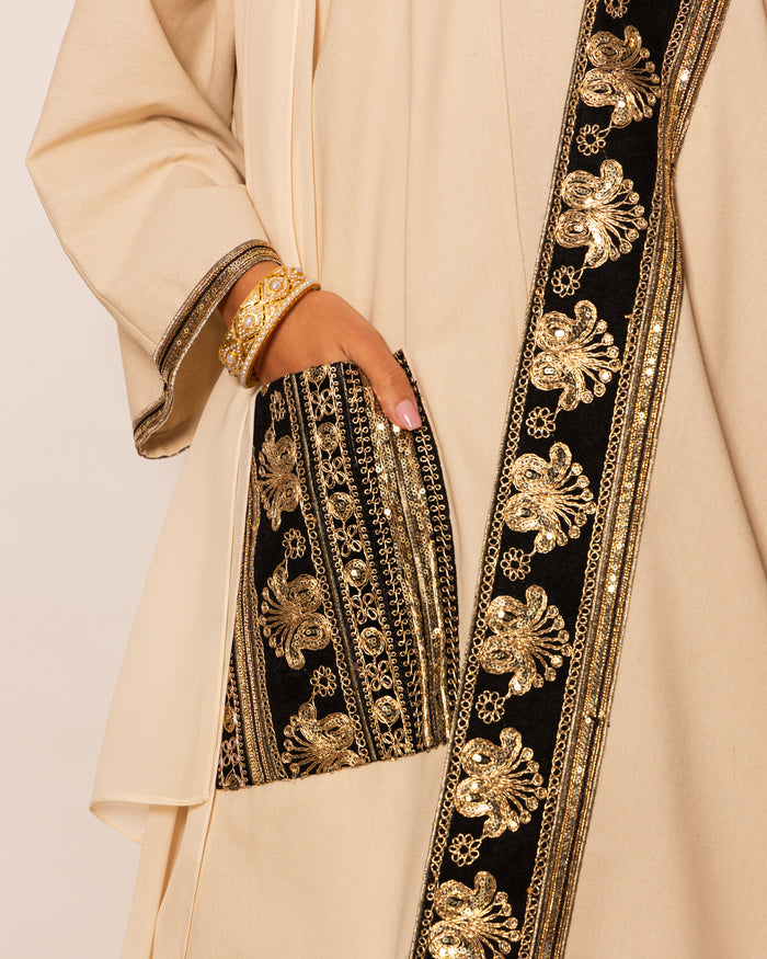 Classic linen abaya with embellished trimmings on pocket, sleeves & hemline