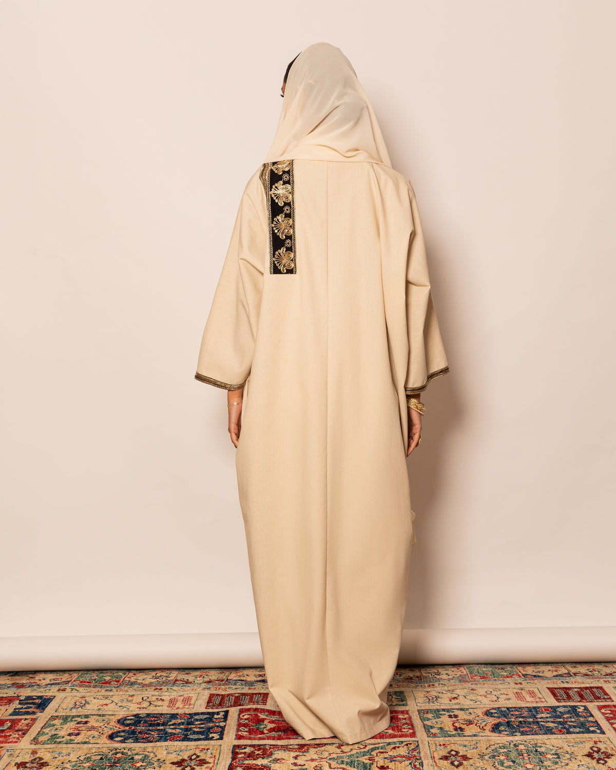 Classic linen abaya with embellished trimmings on pocket, sleeves & hemline